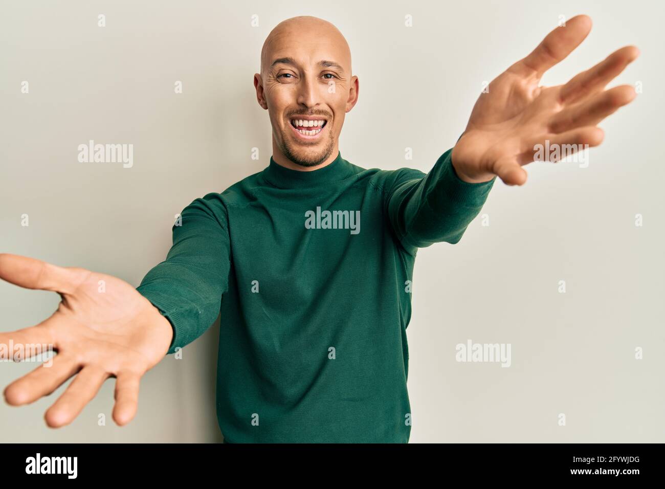 bald man turtleneck