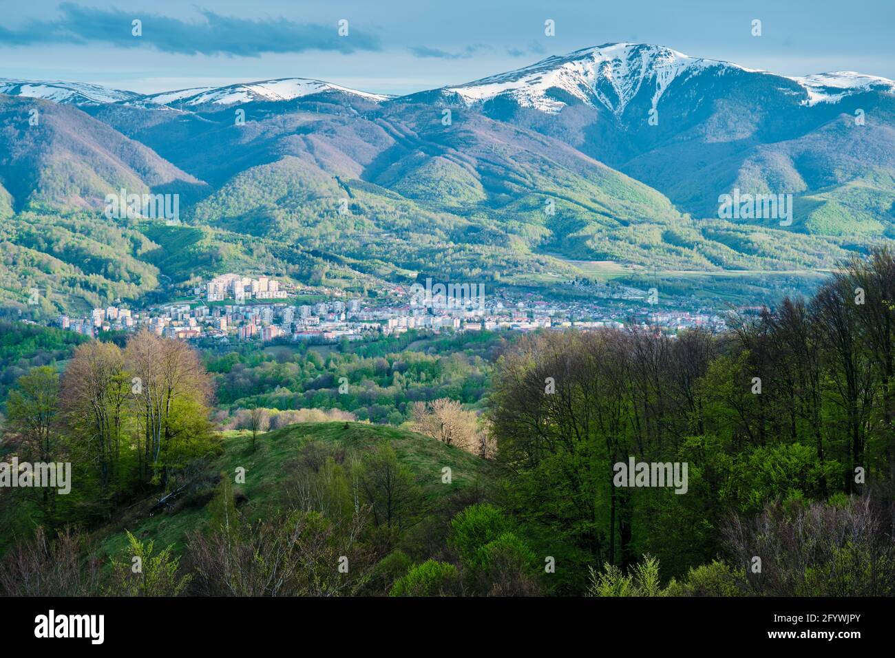 The sunlight on the village at the foot of beautiful mountains Stock ...