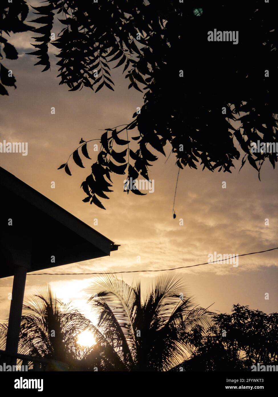 A beautiful shot of the cloudy sky during sunset framed with ...