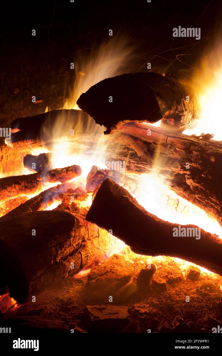 Burning fire and wood with sparks and smoke, winter ambience Stock