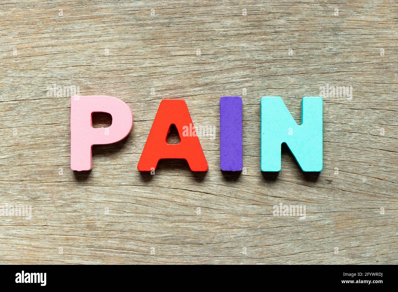 Color alphabet letter in word pain on wood background Stock Photo Alamy