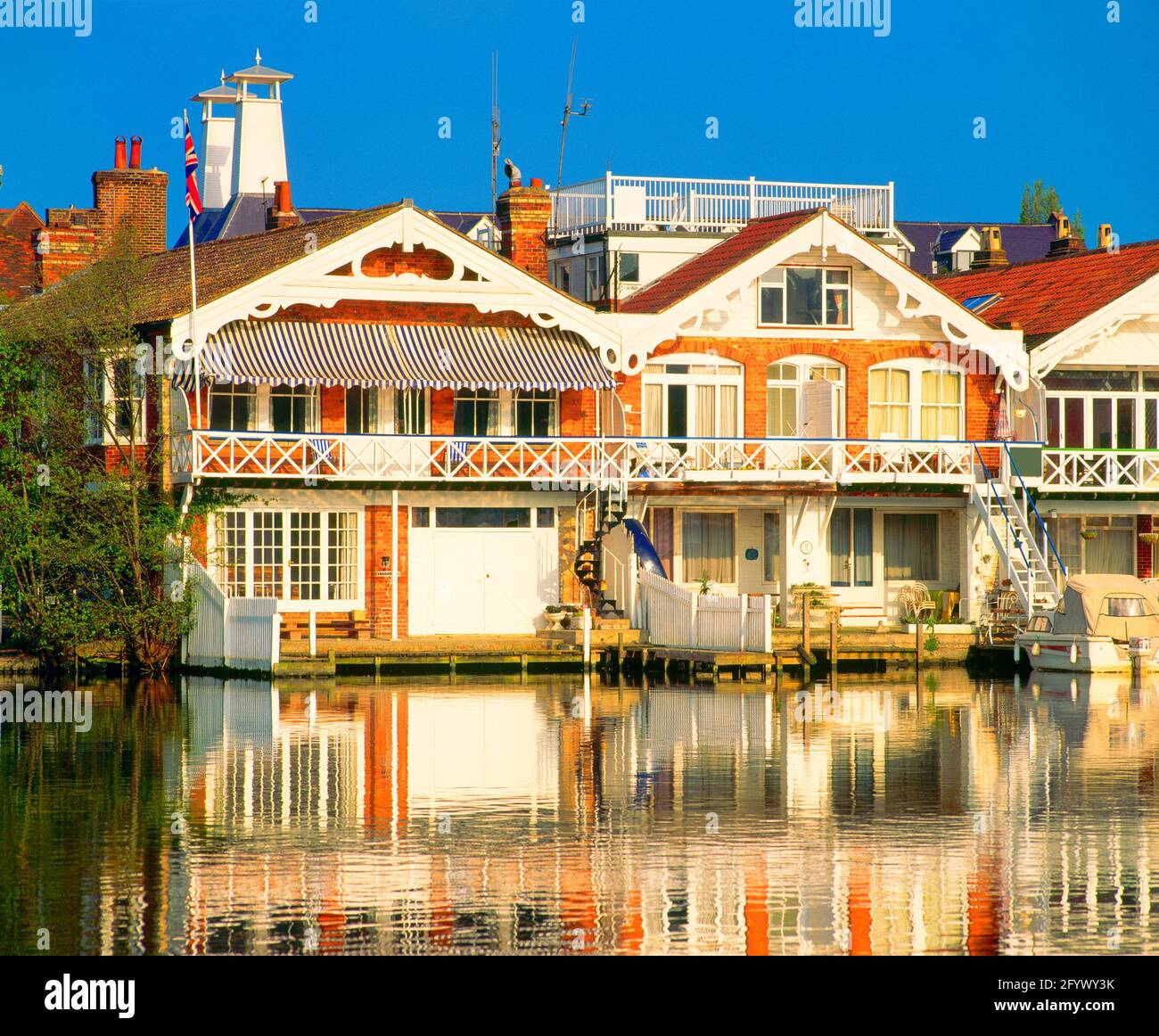 UK, England, Oxfordshire, Henley-on-Thames, boathouses on riverside, Stock Photo