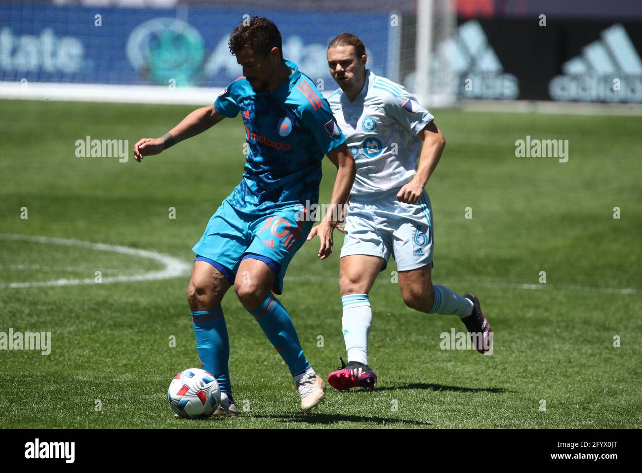 Chicago Fire FC midfielder Gaston Gimenez (30) dribbles the ball during a MLS match against the CF Montréal at Soldier Field, Saturday, May 29, 2021, Stock Photo