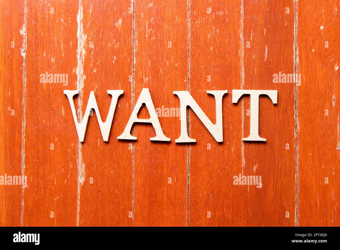 Alphabet letter in word want on old red color wood plate background ...