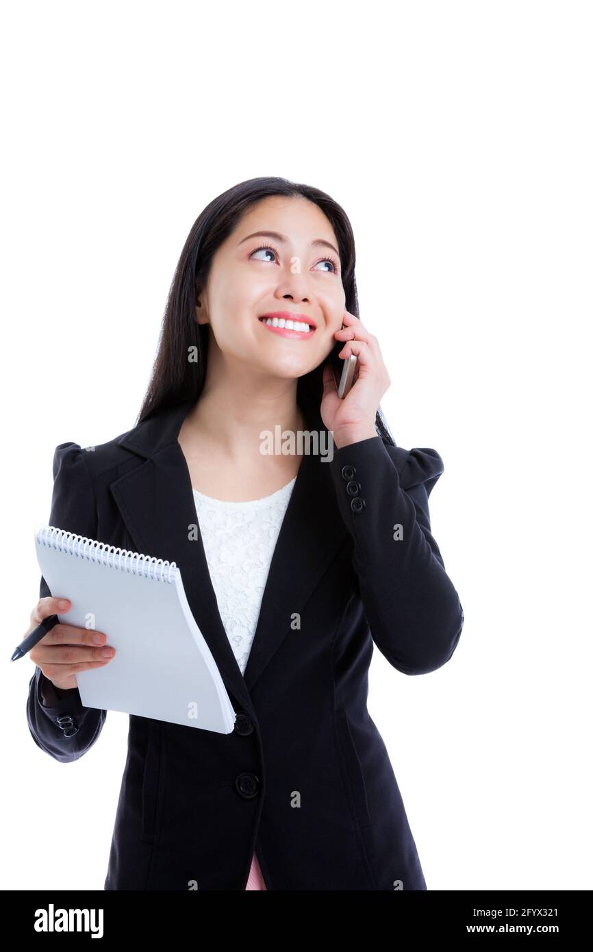 Young happy businesswoman talking on mobile phone and holding note