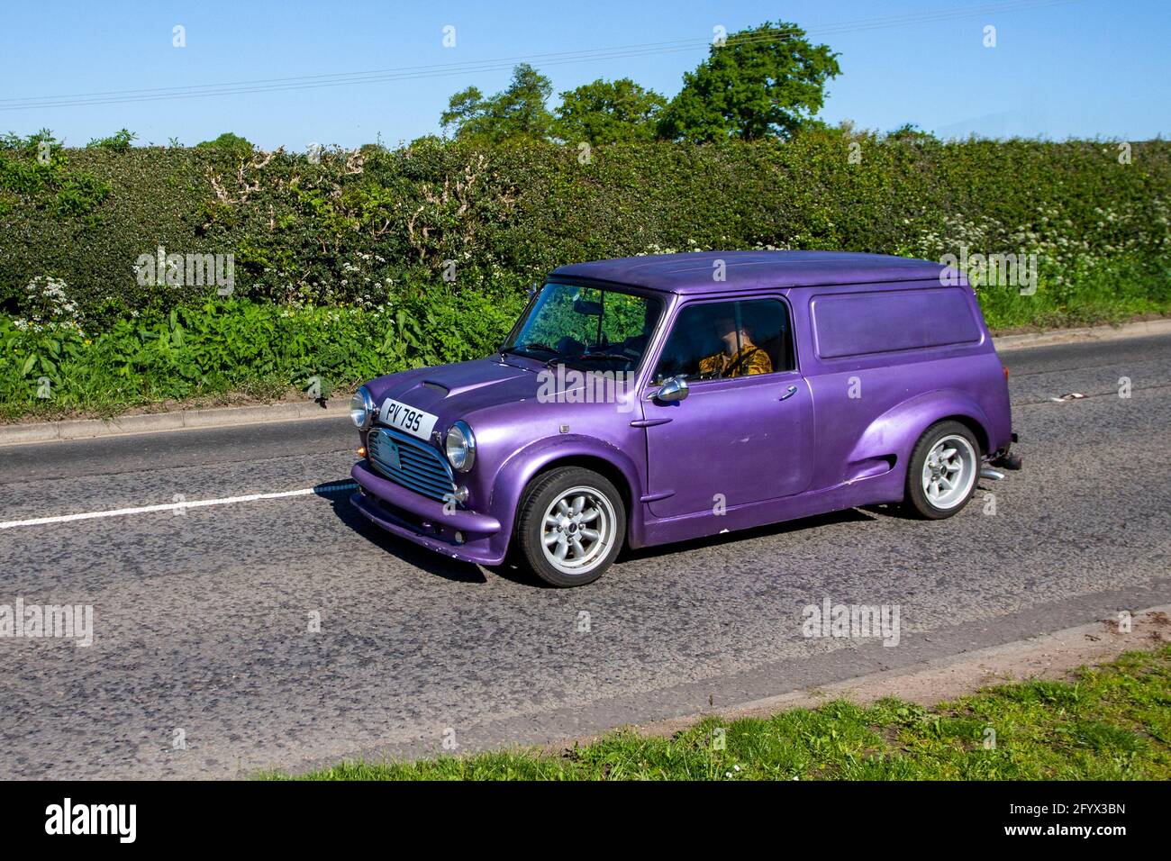 1983 80s modified repainted Austin Morris mini van; Vehicular traffic,  moving vehicles, cars, vehicle driving on