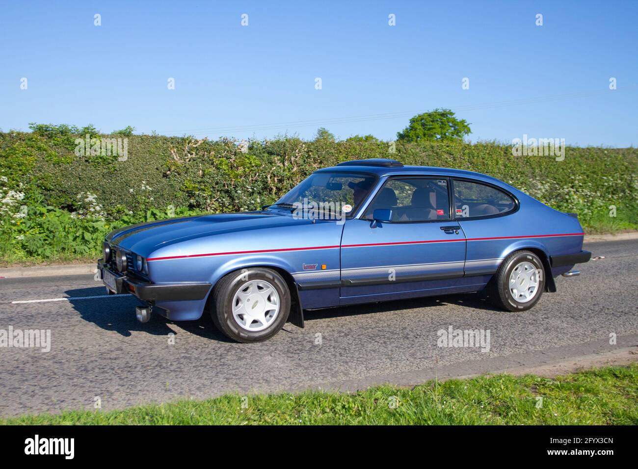 1987 80s blue Ford Capri Laser fastback coupé, 2000cc petrol hatchback  en-roue to Capesthorne Hall classic car event, Cheshire UK Stock Photo -  Alamy