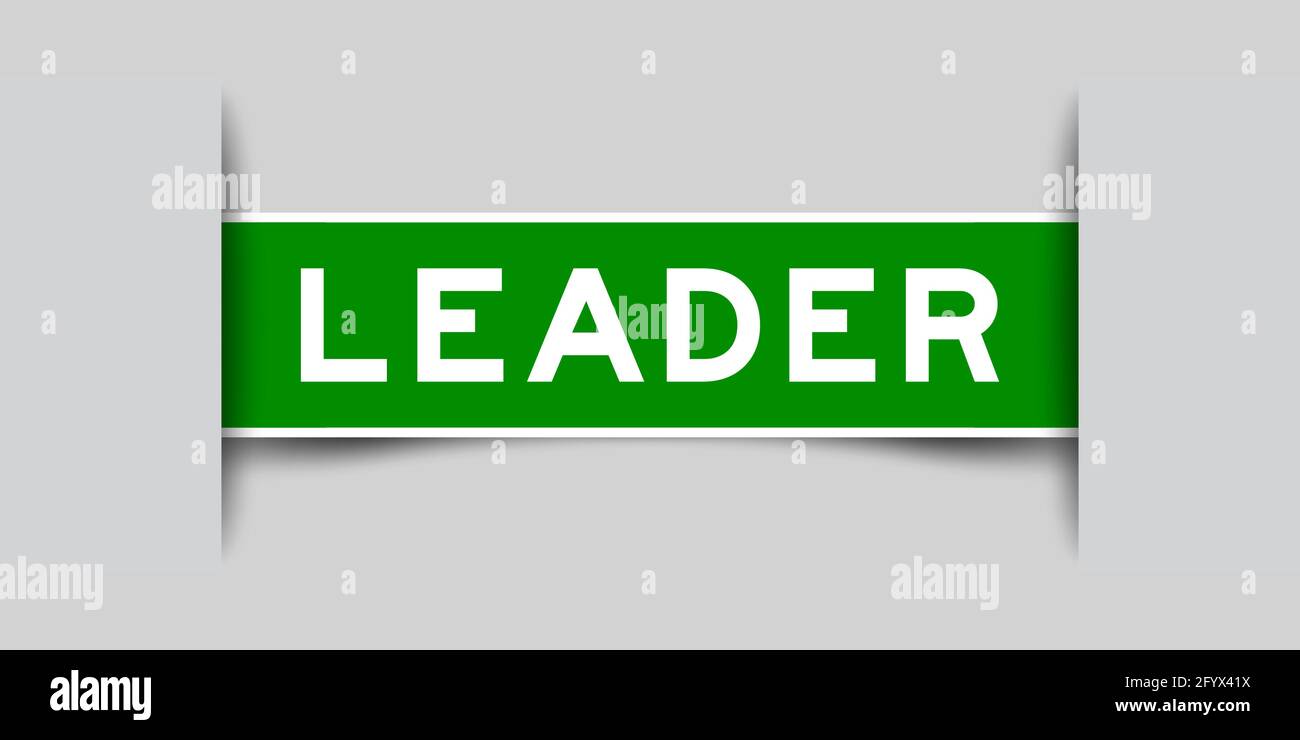 Inserted green color label sticker with word leader on gray background ...