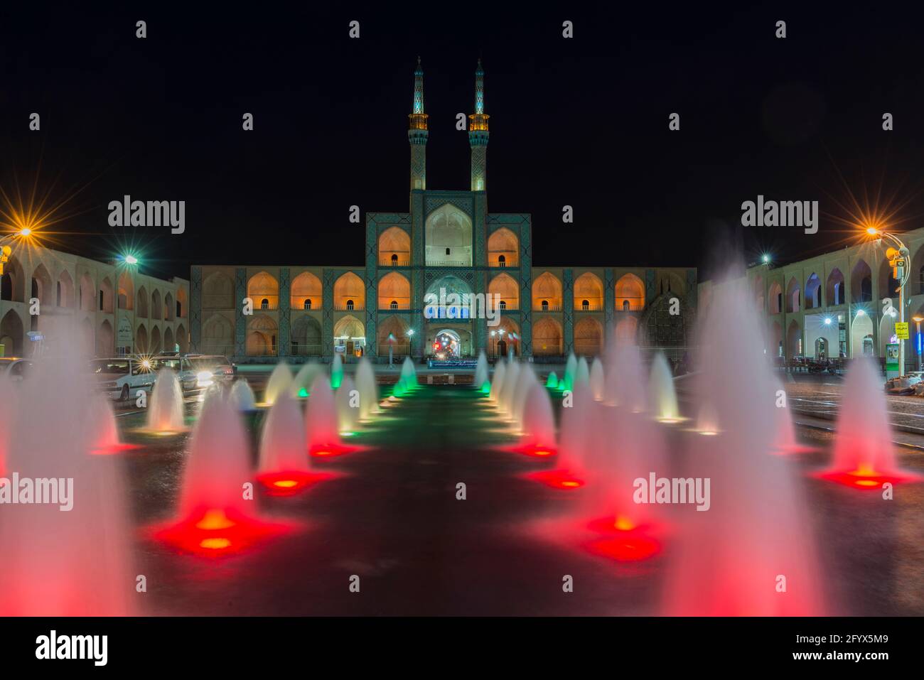 Illuminated Amir Chakhmaq Complex, - square and fountain at night. Yazd, Yazd Province, Iran. Stock Photo