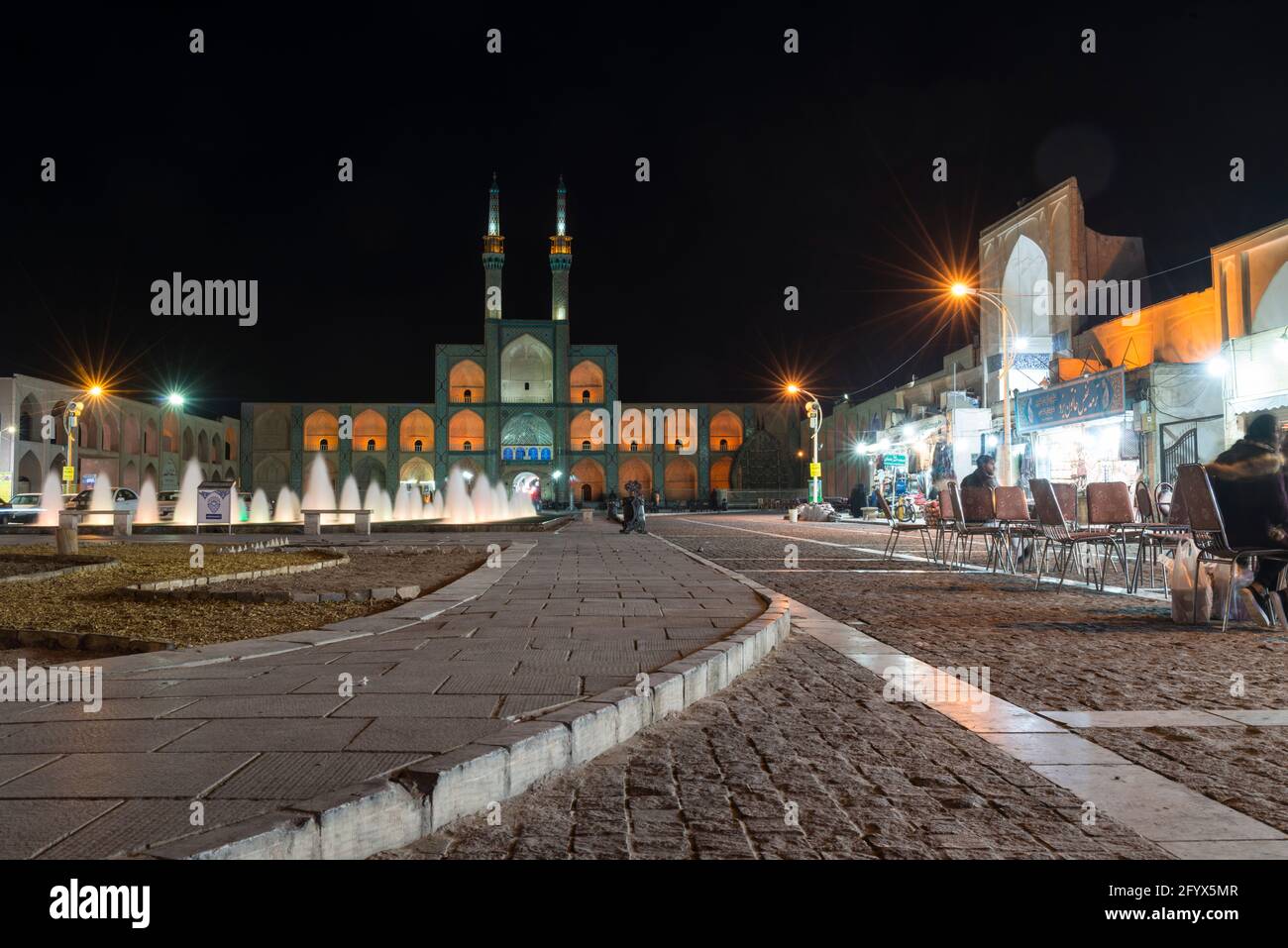 Illuminated Amir Chakhmaq Complex, - square and fountain at night. Yazd, Yazd Province, Iran. Stock Photo