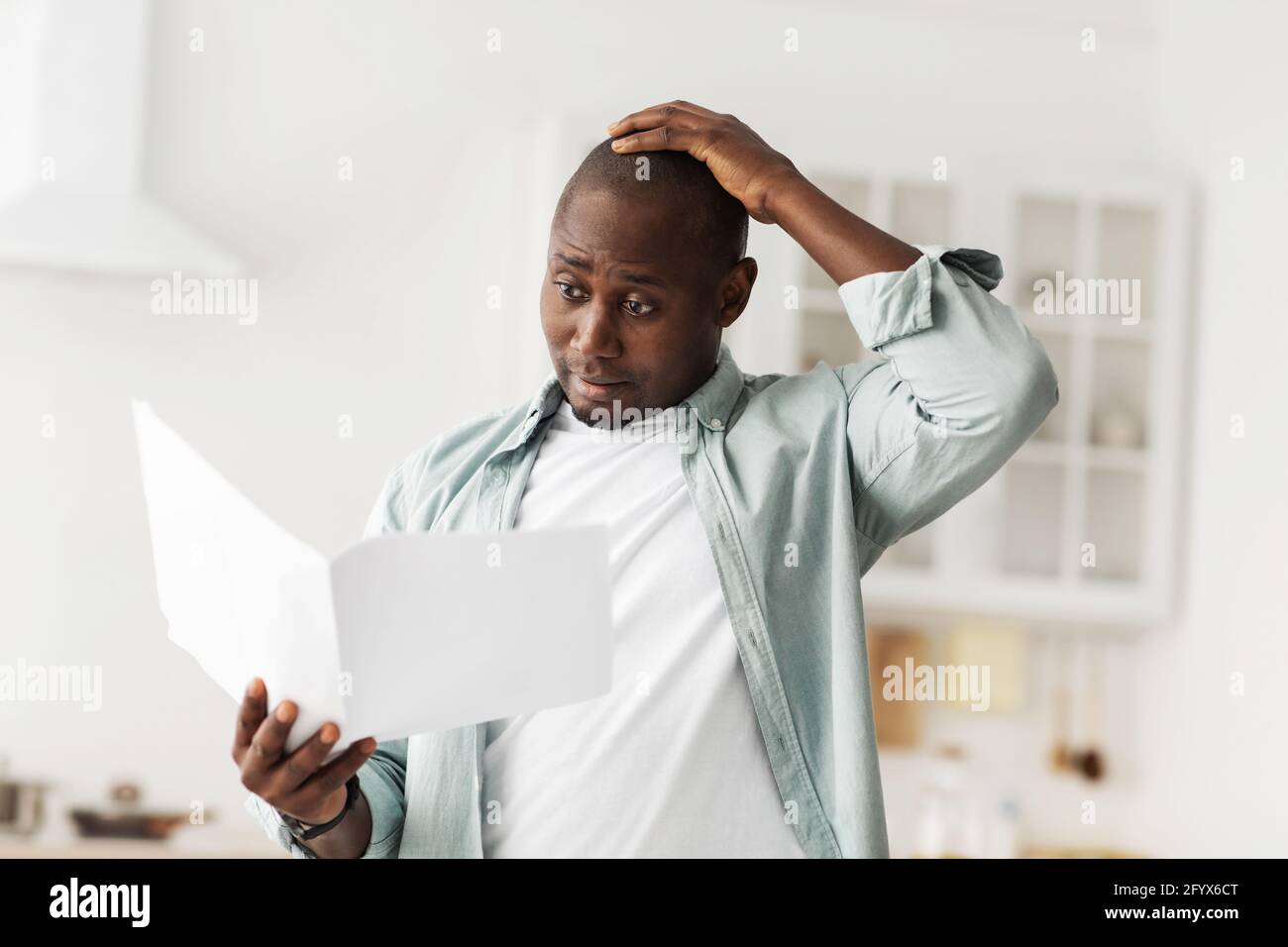 Selfassembly furniture. Shocked african american man reading