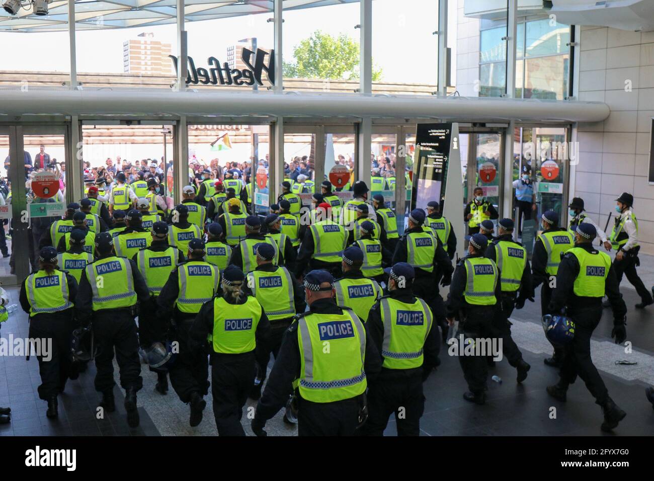 LONDON, UK. MAY 29TH Anti-vaxx protesters clash with police while storming Westfield shopping centre, Stratford, London on Saturday 29th May 2021. (Credit: Lucy North | MI News) Credit: MI News & Sport /Alamy Live News Stock Photo