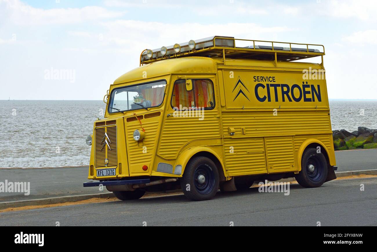 Classic yellow  Citroen Hy Van with Service Citroen logo on the side parked on seafront promenade. Stock Photo