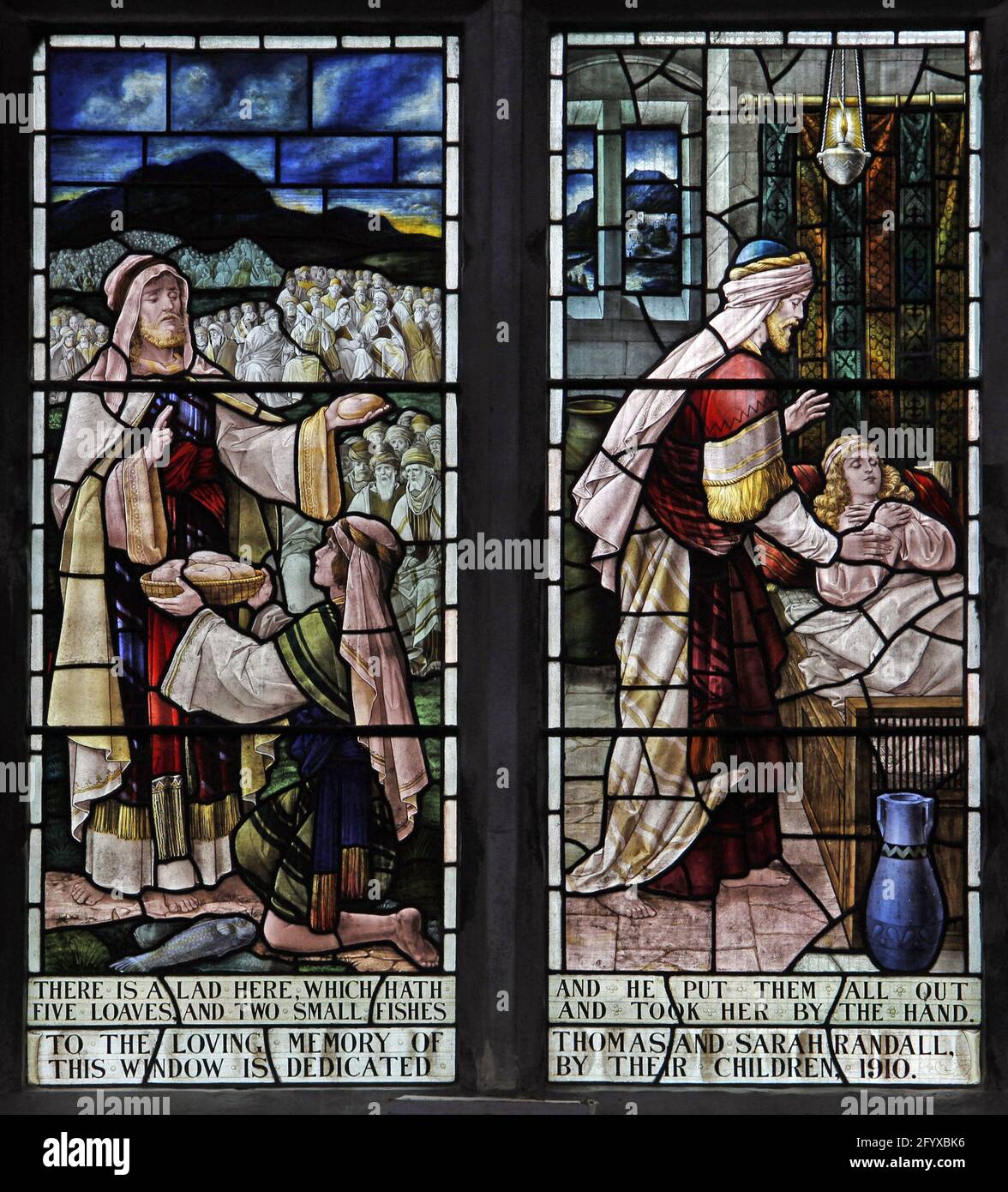Stained glass window by Percy Bacon & Brothers depicting Christ healing and feeding the 5000, Lady St Mary  Church, Wareham, Dorset Stock Photo