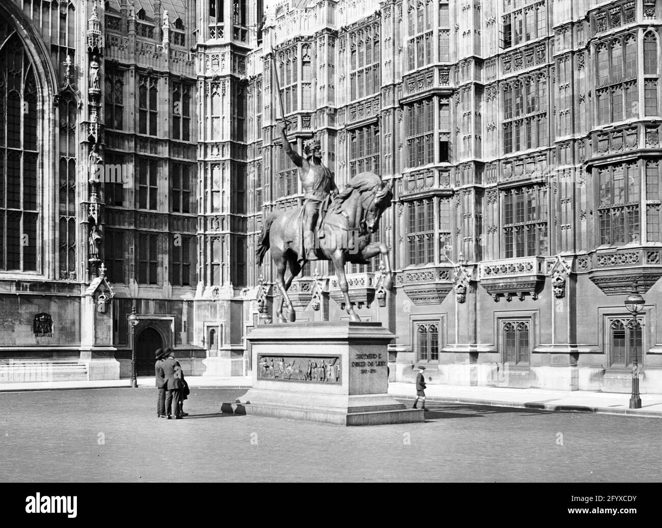 Equestrian statue of Richard I of England, also known as Richard the Lionheart, in the Old Palace Yard outside the Houses of Parliament at the Palace of Westminster, City of Westminster, London, England, United Kingdom, 1921. (Photo by Burton Holmes) Stock Photo