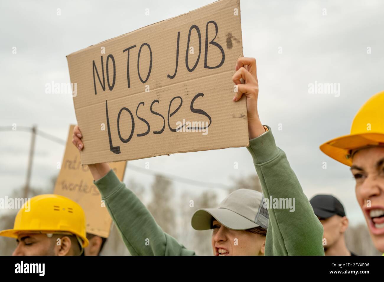 Hands of engineers holding messages of protest on strike Stock Photo ...