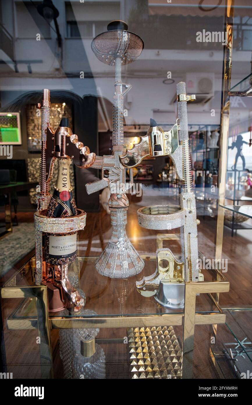 Kalashnikow champagne bottle holders in the window of russian luxury shop  in Altea, Alicante, Spain Stock Photo - Alamy