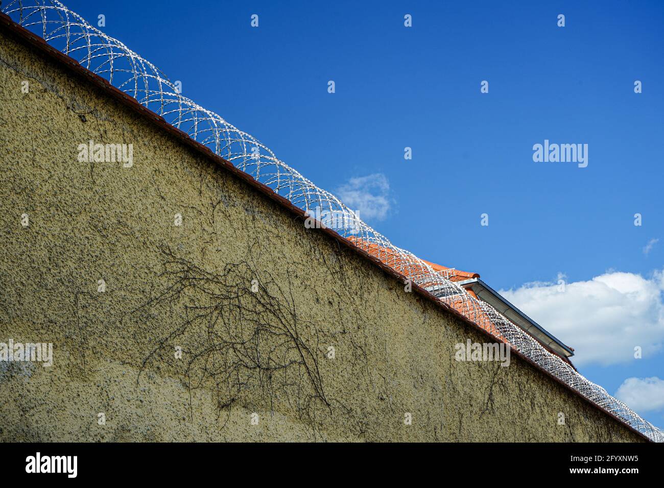 Erding Prison in Upper Bavaria is a deportation prison for diverted asylum seekers. Behind walls and barbed wire, all prospects for the refugees end. Stock Photo