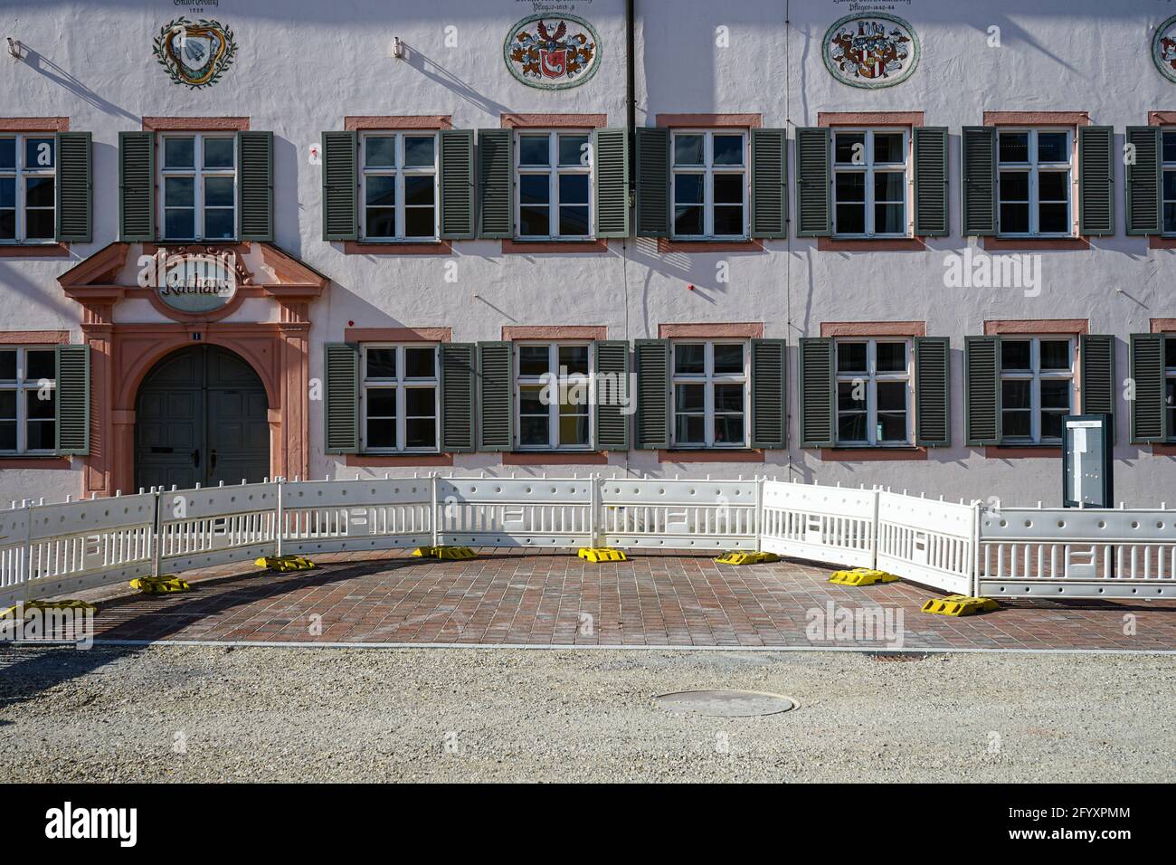 Town hall of the Upper Bavarian town Erding in the Munich metropolitan area. A construction site in front of the medieval building. Stock Photo