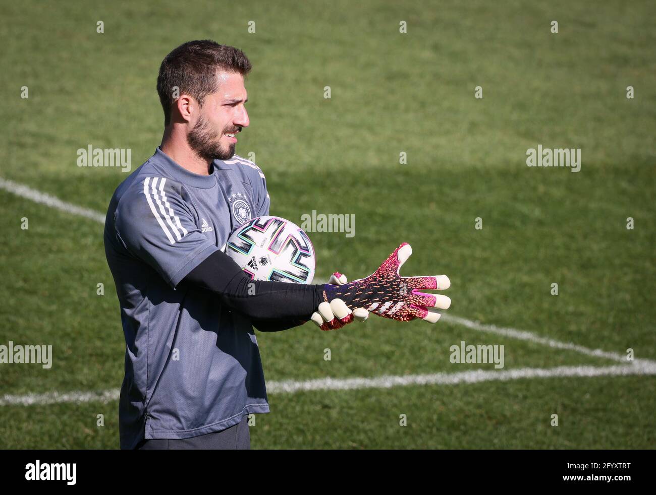 Seefeld, Austria. 30th May, 2021. Football: National team, training camp,  training: Goalkeeper Kevin Trapp puts on his gloves. Credit: Christian  Charisius/dpa - IMPORTANT NOTE: In accordance with the regulations of the  DFL