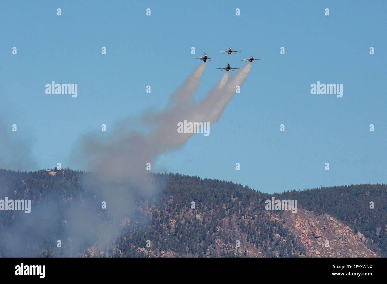 The USAF Air Demonstration Squadron Thunderbirds perform in Colorado Springs over the United States Air Force Academy. Stock Photo