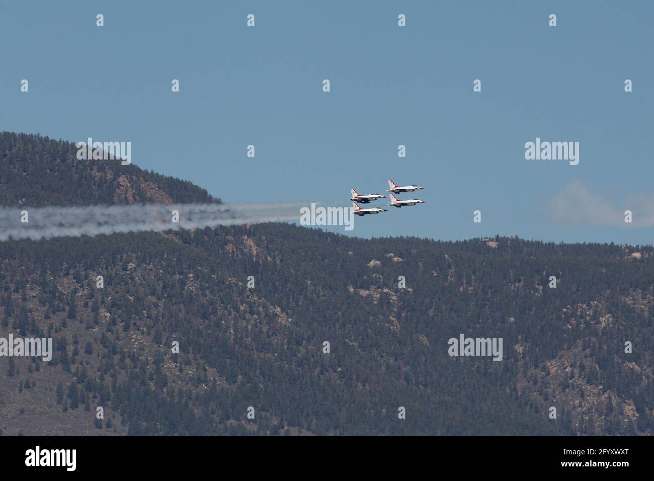 The USAF Air Demonstration Squadron Thunderbirds perform in Colorado Springs over the United States Air Force Academy. Stock Photo