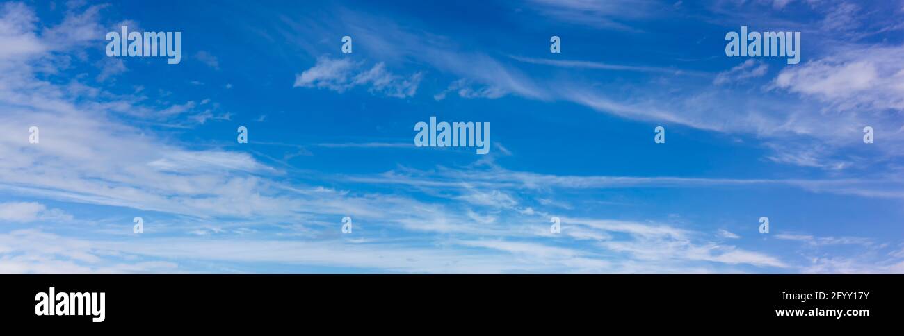 Panorama of blue sky with blurred white clouds. Abstraction of a cloudless clear sky Stock Photo
