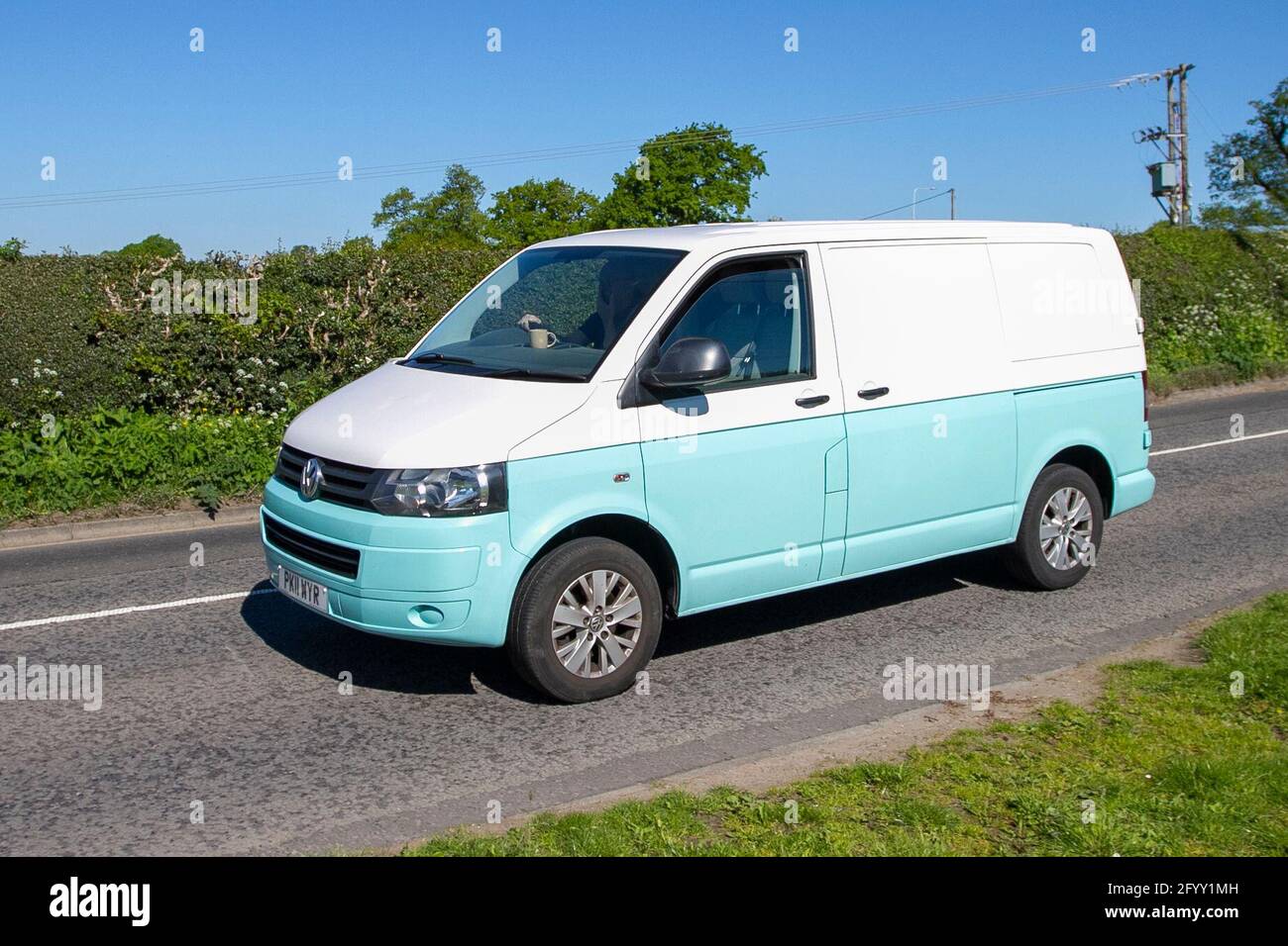 2011 VW Volkswagen Transporter T28 102 panel van; Vehicular traffic, moving  vehicles, cars, vehicle driving en-route to Capesthorne Hall classic May  car show, Cheshire, UK Stock Photo - Alamy