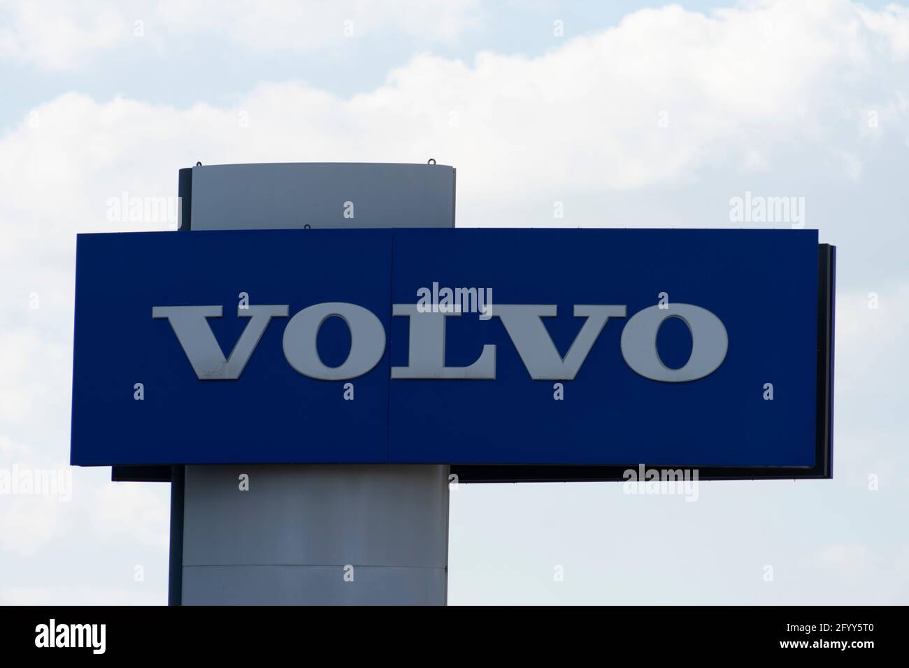 Volvo automobile dealership sign and logo. Volvo is a Swedish multinational manufacturing company, provider of trucks, buse, construction equipment Stock Photo
