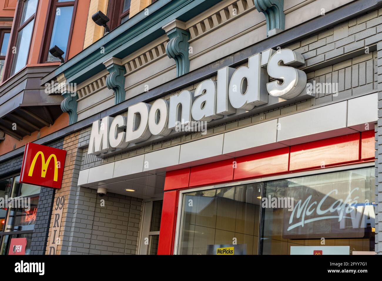 Ottawa, Canada - May 23, 2021: Sign on the front entrance of McDonald's fast food restaurant in the downtown of Ottawa. Stock Photo