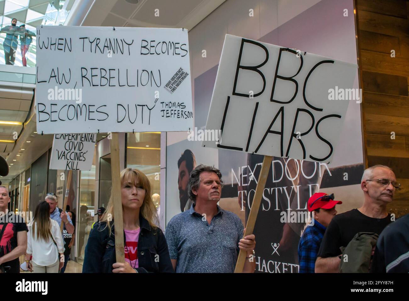 WHITE CITY, LONDON, ENGLAND- 29 May 2021: Protesters inside Westfield White City during a Unite For Freedom anti-lockdown protest in London Stock Photo