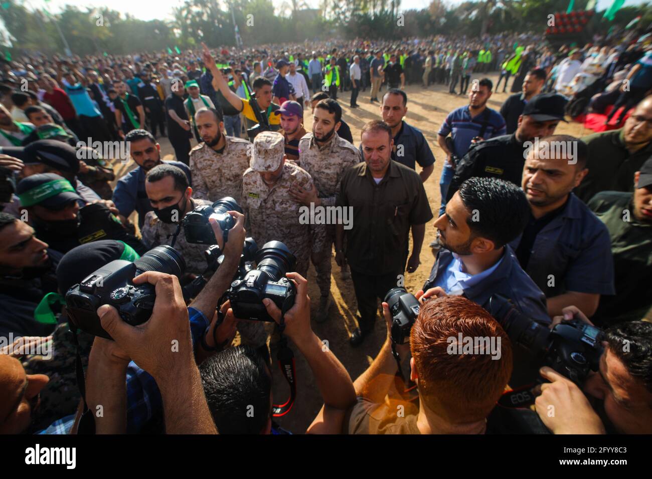 Under the leadership of wanted men of Hamas, Al-Qassam holds a celebration and a military parade to honor the families of the martyrs in northern Gaza Stock Photo