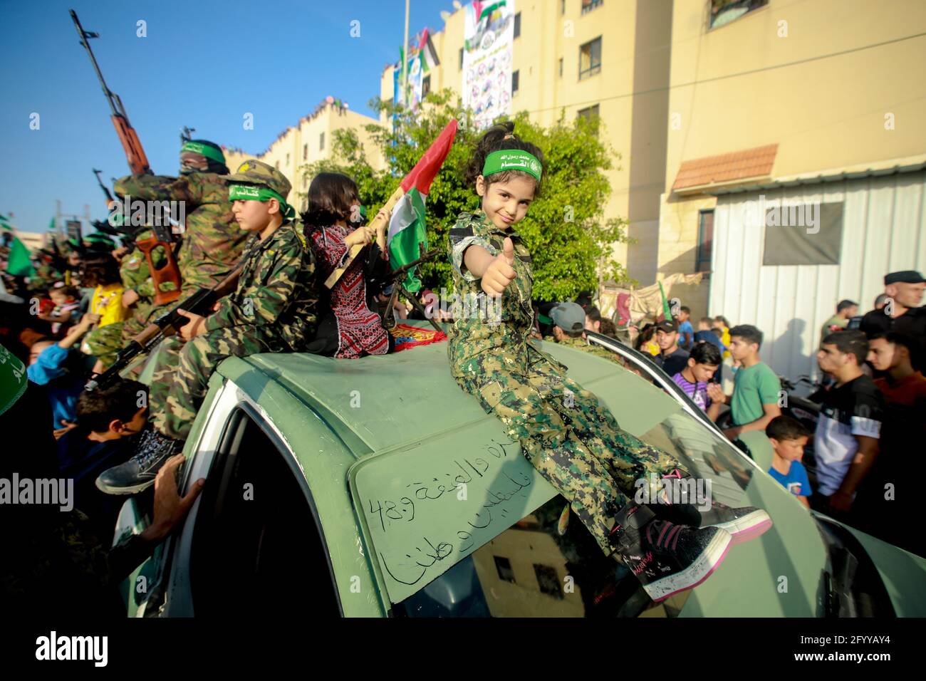 Under the leadership of wanted men of Hamas, Al-Qassam holds a celebration and a military parade to honor the families of the martyrs in northern Gaza Stock Photo