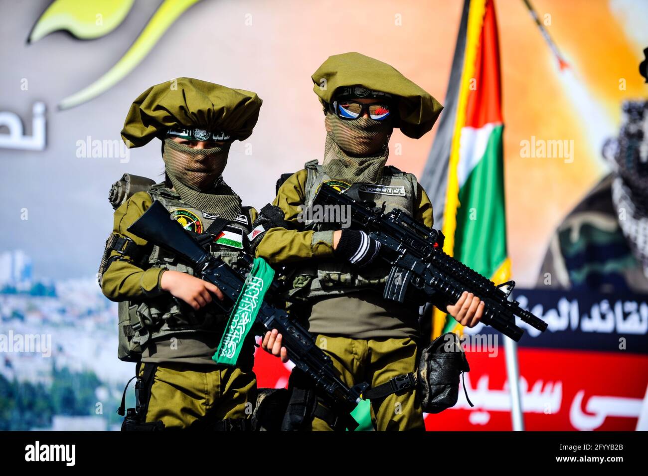 Under the leadership of wanted men of Hamas, Al-Qassam holds a celebration and a military parade to honor the families of the martyrs in northern Gaza Stock Photo