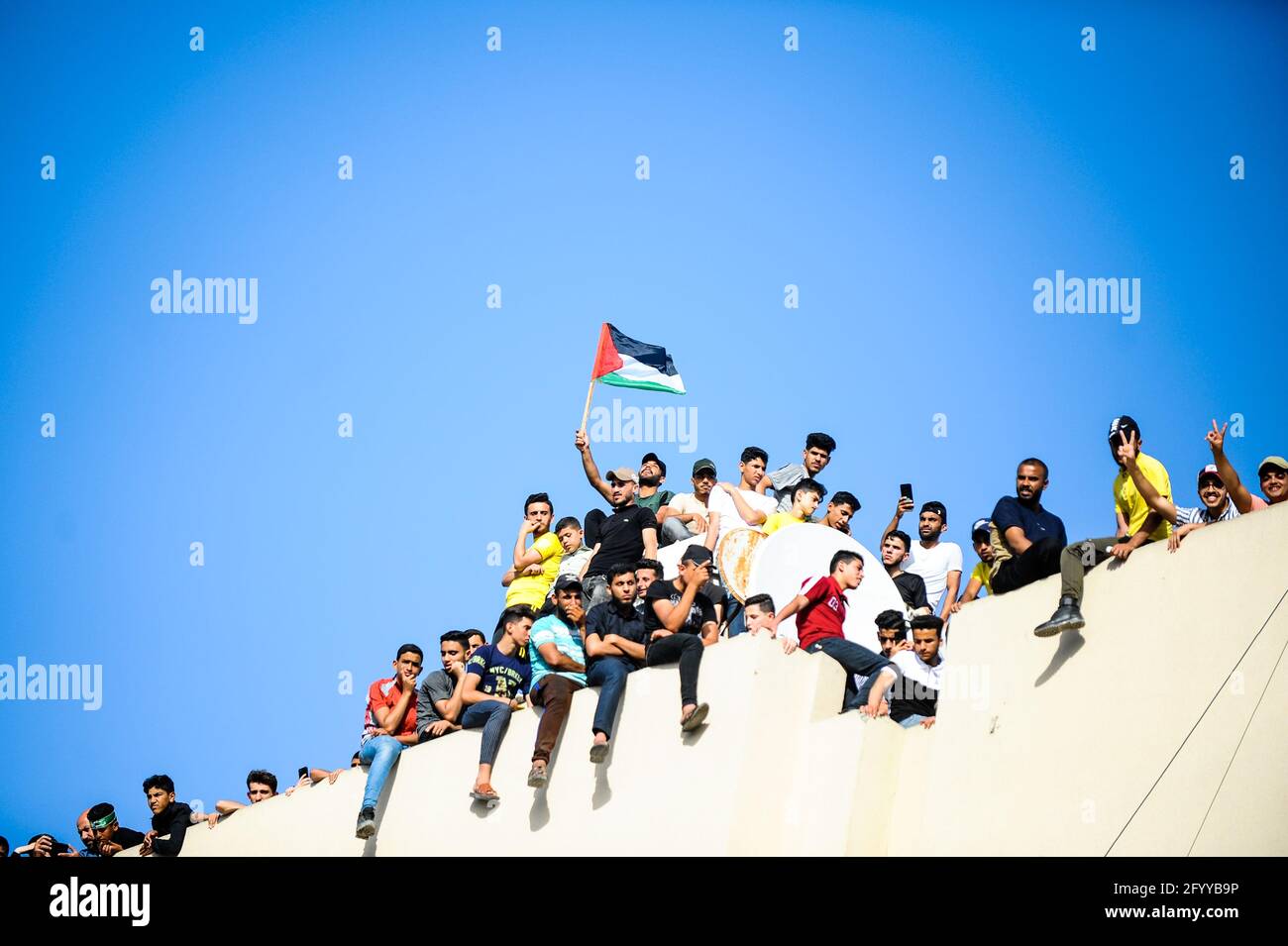 Under the leadership of wanted men of Hamas, Al-Qassam holds a celebration and a military parade to honor the families of the martyrs in northern Gaza Stock Photo