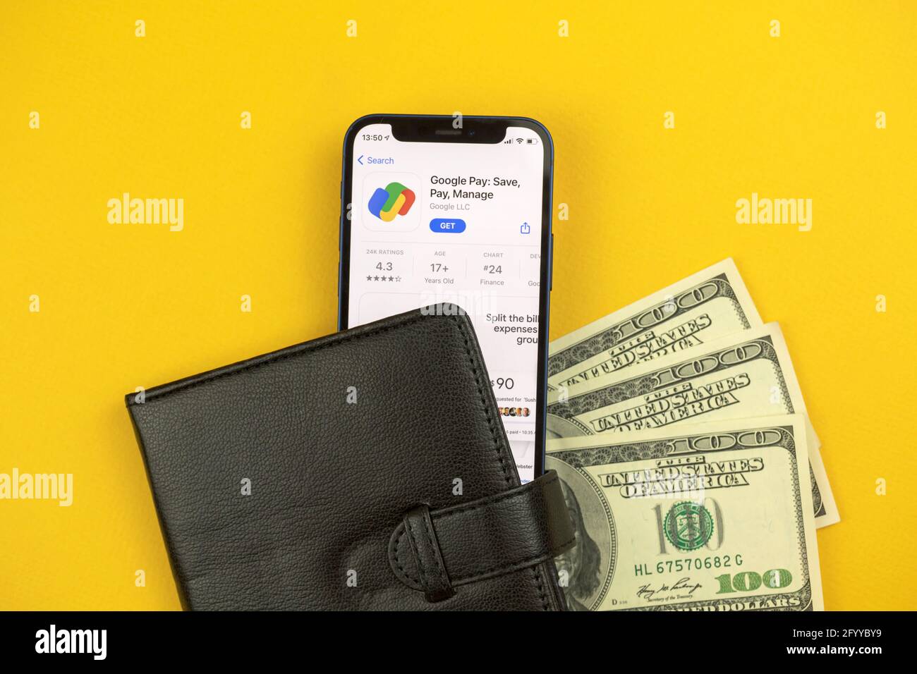 Kharkov, Ukraine - May 28, 2021: Google Pay app on the screen, money background Stock Photo