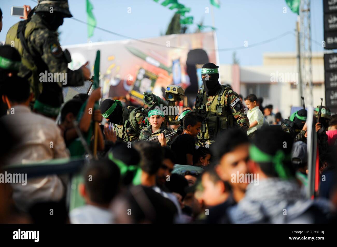 Under the leadership of wanted men of Hamas, Al-Qassam holds a celebration and a military parade to honor the families of the martyrs in northern Gaza Stock Photo