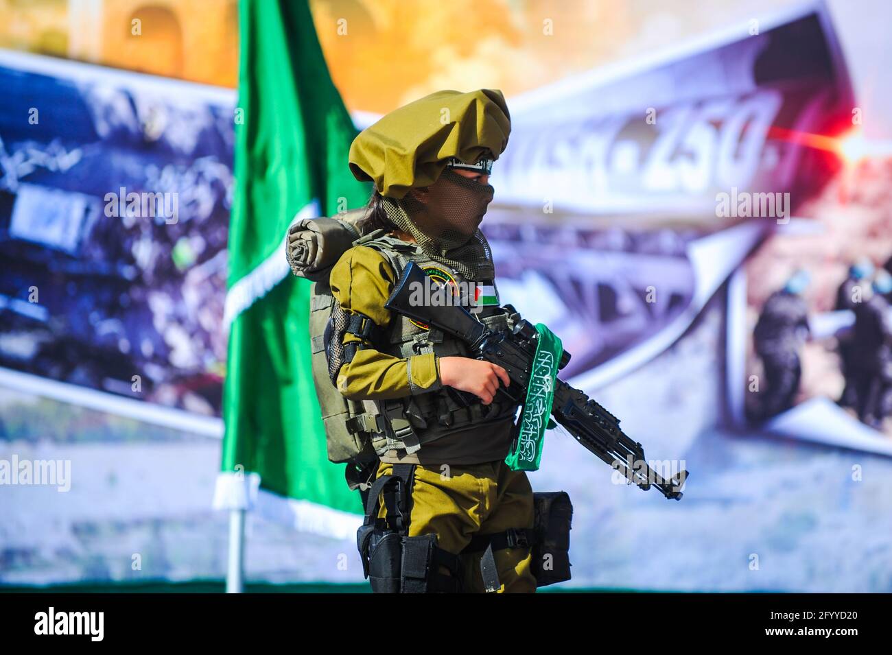 Under the leadership of wanted men of Hamas, Al-Qassam holds a celebration and a military parade to honor the families of the martyrs in northern Gaza Stock Photo