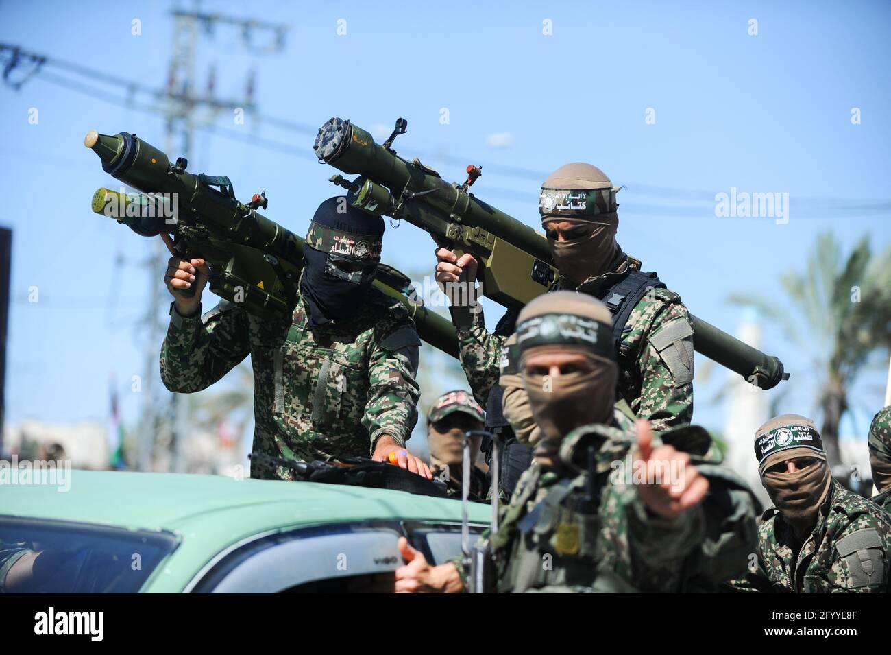 Under the leadership of wanted men of Hamas, Al-Qassam holds a celebration and a military parade to honor the families of the martyrs in northern Gaza Stock Photo