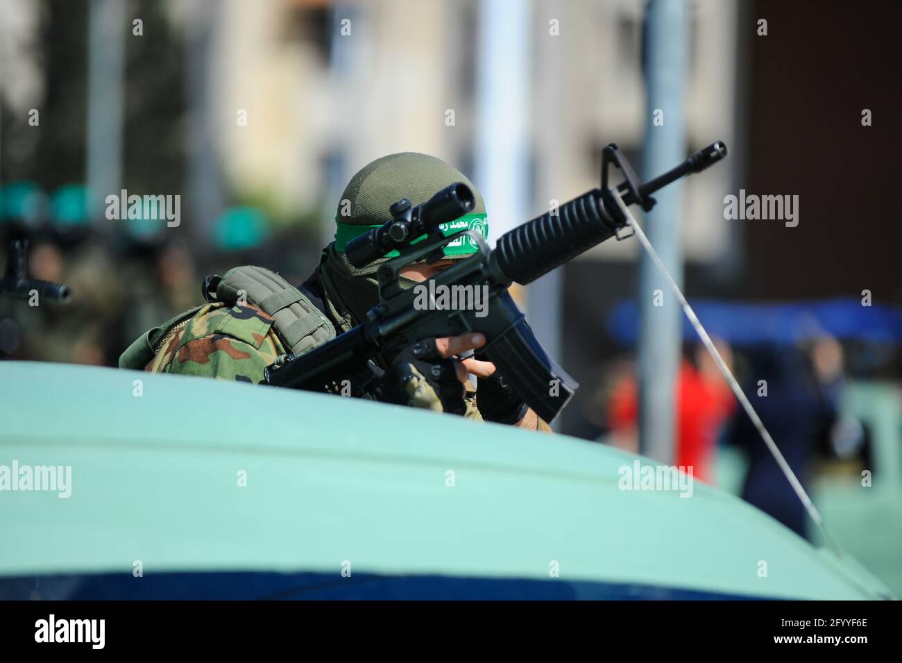 Under the leadership of wanted men of Hamas, Al-Qassam holds a celebration and a military parade to honor the families of the martyrs in northern Gaza Stock Photo