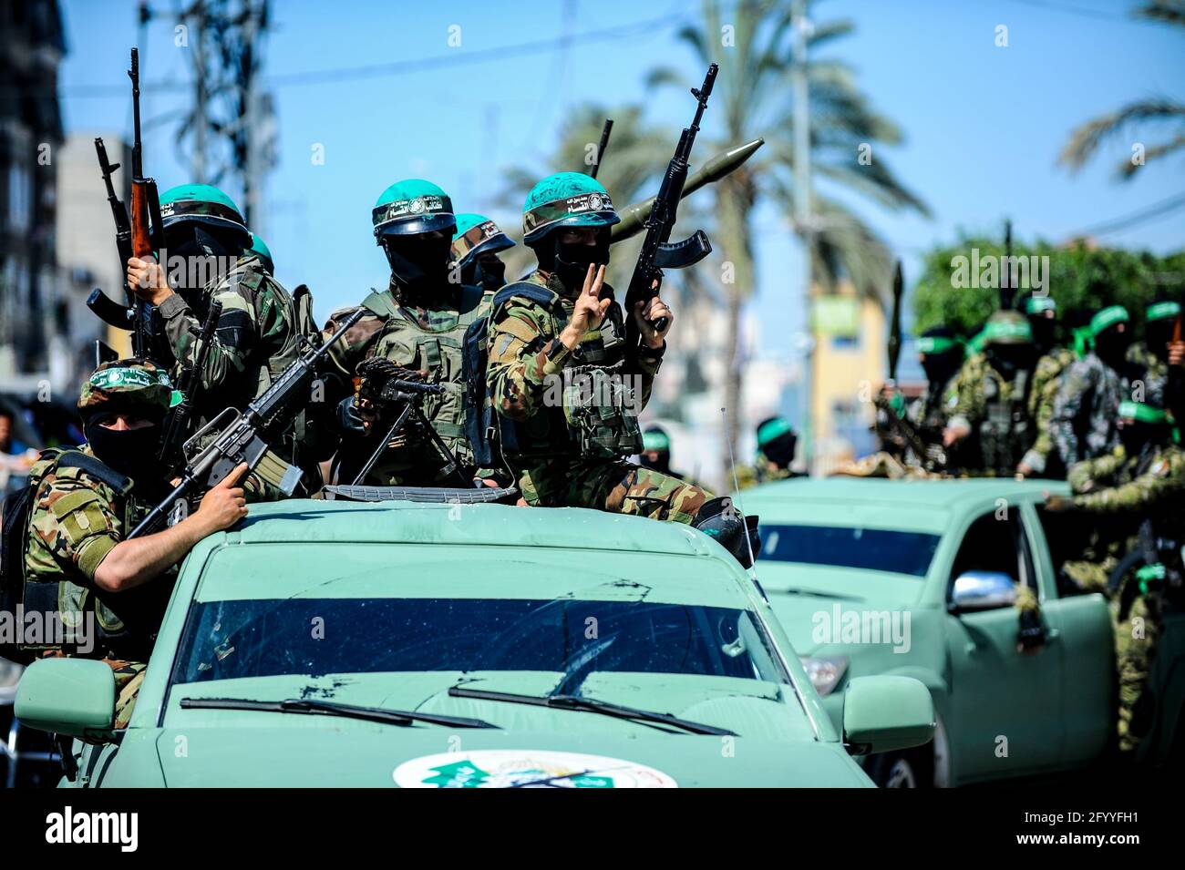 Under the leadership of wanted men of Hamas, Al-Qassam holds a celebration and a military parade to honor the families of the martyrs in northern Gaza Stock Photo