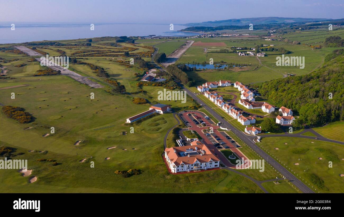 Turnberry, Scotland, UK. 30th May, 2021. PICTURED: Drone photography view of Trump Turnberry Golf Resort under the hot afternoon sunshine. Restrictions have lifted allowing the hotel to reopen back up allowing tourists to come in and play a round of golf. Former US President Donald Trump owed the hotel and golf resort, who passed to his son Eric Trump when his father took office in the White House. Pic Credit: Colin Fisher/Alamy Live News Stock Photo