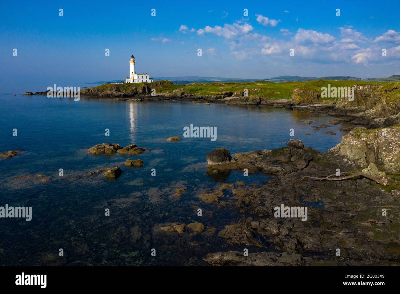 Turnberry, Scotland, UK. 30th May, 2021. PICTURED: Drone photography view of Trump Turnberry Golf Resort under the hot afternoon sunshine. Restrictions have lifted allowing the hotel to reopen back up allowing tourists to come in and play a round of golf. Former US President Donald Trump owed the hotel and golf resort, who passed to his son Eric Trump when his father took office in the White House. Pic Credit: Colin Fisher/Alamy Live News Stock Photo