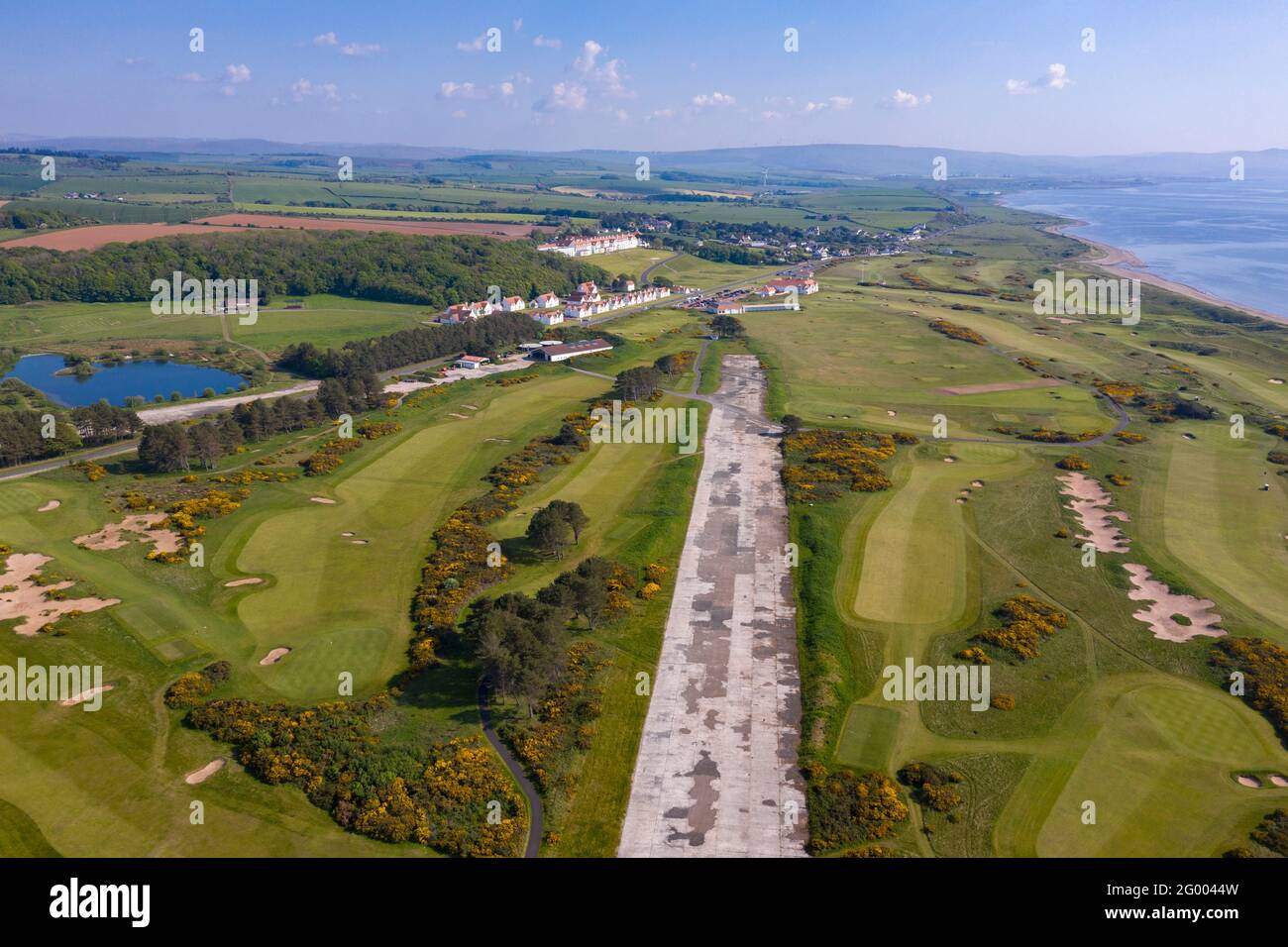 Turnberry, Scotland, UK. 30th May, 2021. PICTURED: Drone photography view of Trump Turnberry Golf Resort under the hot afternoon sunshine. Restrictions have lifted allowing the hotel to reopen back up allowing tourists to come in and play a round of golf. Former US President Donald Trump owed the hotel and golf resort, who passed to his son Eric Trump when his father took office in the White House. Pic Credit: Colin Fisher/Alamy Live News Stock Photo