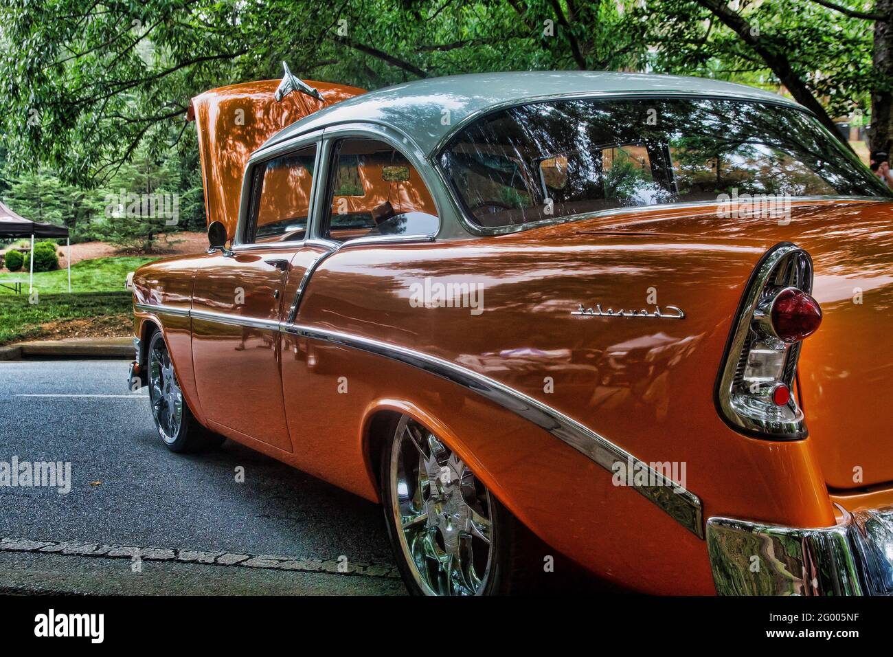Classic Orange Car in Park Stock Photo