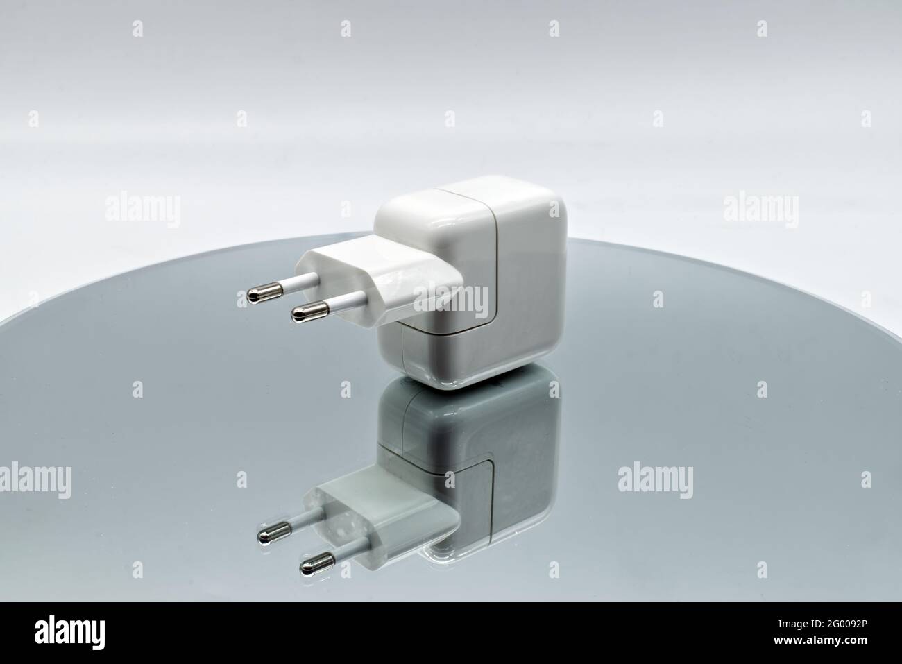 Bologna - Italy - May 15, 2021: Apple Power adapter USB 12W developed by Apple Inc. Stock Photo