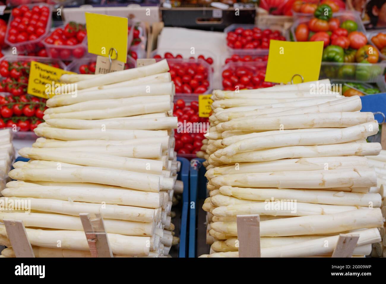 Heap of White Asparagus sold in front of farmer market stall in Germany. Stock Photo