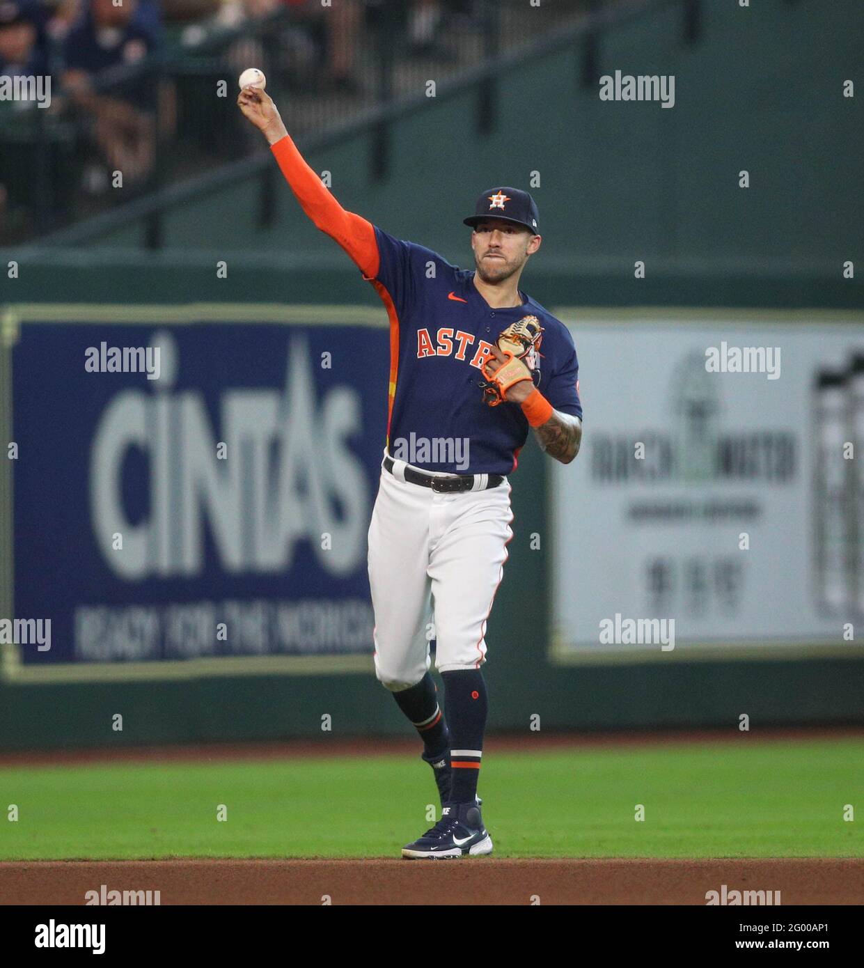 May 30, 2021: Carlos Correa (1) makes a throw to first base for