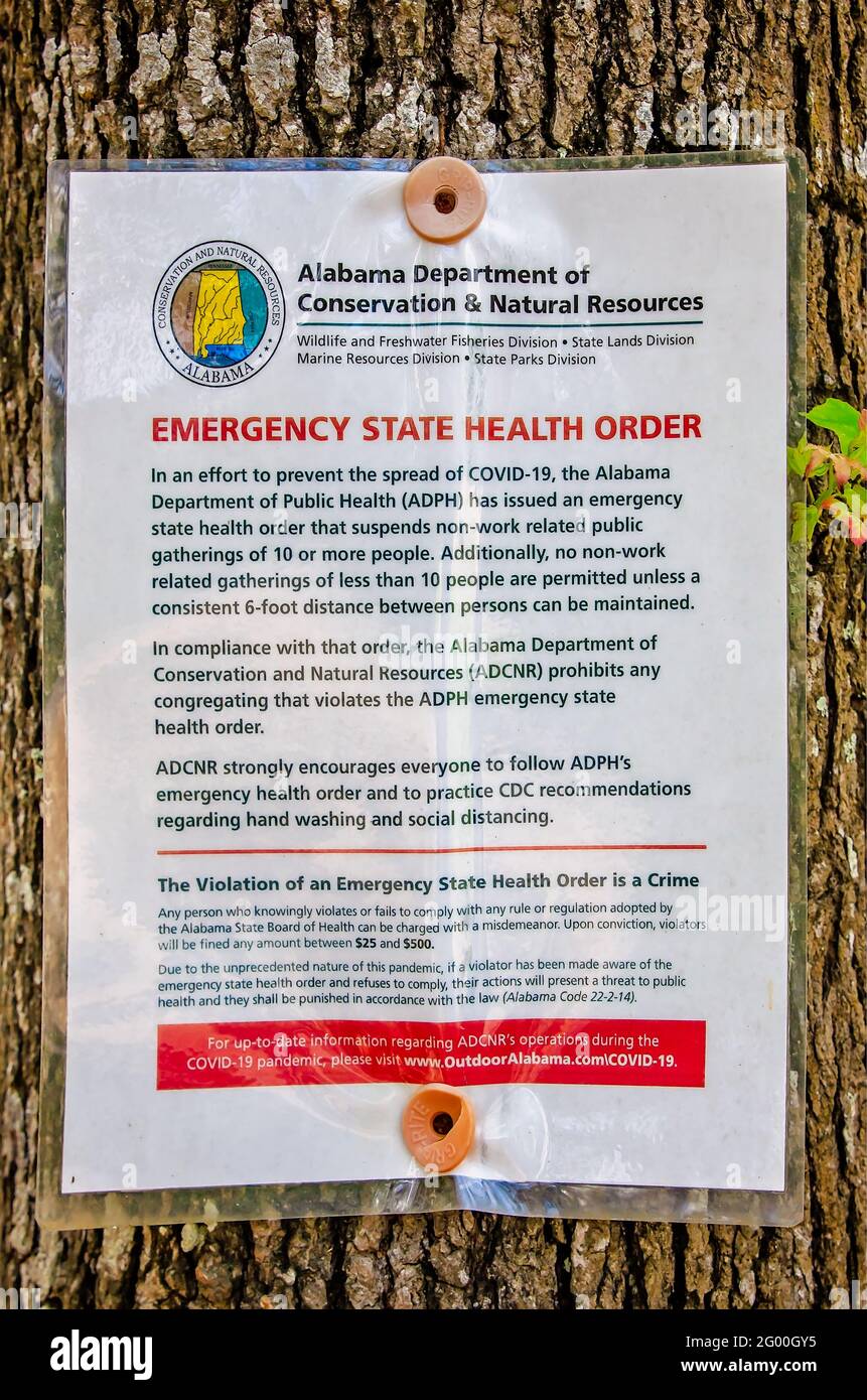 An Alabama Emergency Health Order is posted at Weeks Bay Reserve, May 27, 2021, in Fairhope, Alabama. Stock Photo