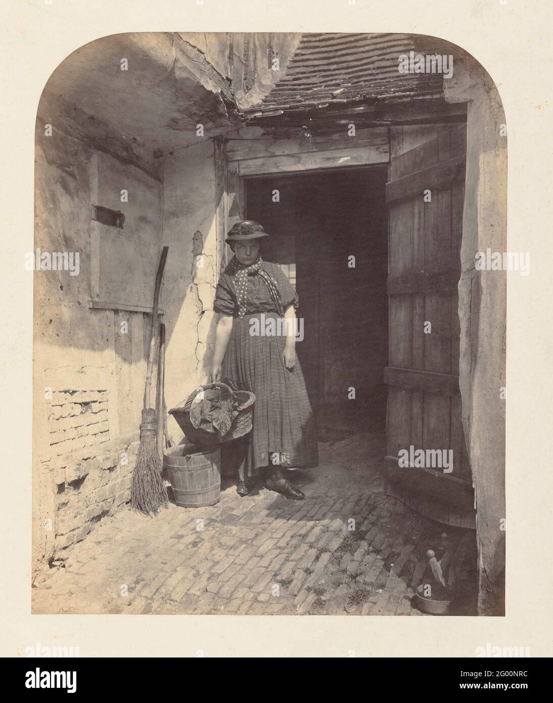 Portrait of a young woman in a doorway Stock Photo - Alamy